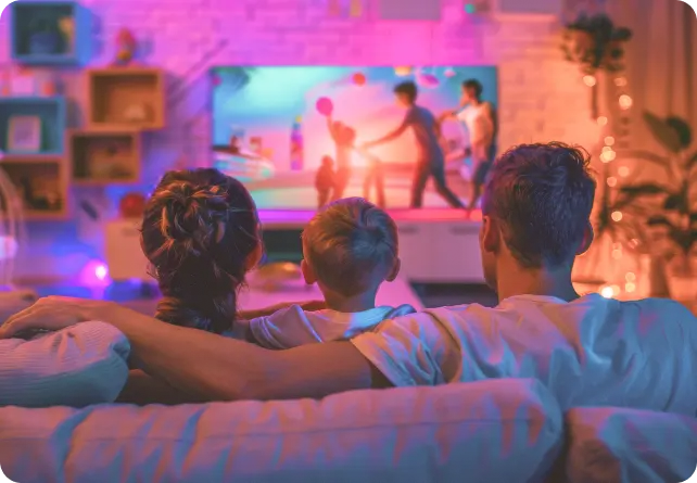 Family watching entertainment on TV with Nomads TV streaming services
